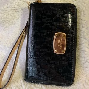 Michael kors phone wallet with a wrist strap